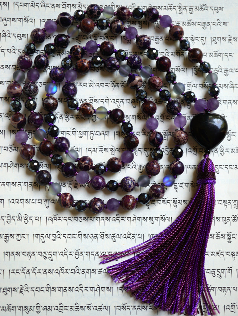 Full view of Purple Impression Jasper Mala with deep purple, black, and gray beads, and a heart-shaped guru with variegated purple sutra/tassel.