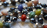A blend of color and shimmer. Multi-colored 8mm rondelle gemstones framed with 4mm faceted Hematite beads and 6mm faceted Black Agate beads. The black knots between the beads and bead units protect and showcase the beads beautifully.