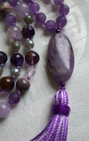 15x30 mm oval Chevron Amethyst guru brings this design full circle, with a variegated lavender tassel spilling from the base of the bead.