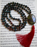 Hand-knotted mala with alternating 6mm and 8mm Dragon Blood Jasper beads and a 20x30mm oval Dragon Blood Jasper guru. A deep red sutra and tassel brings this one-of-a-kind design full circle.