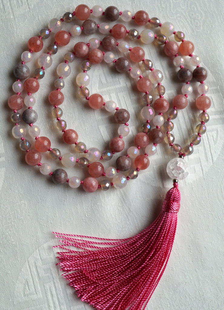 Hand-knotted mala with 8mm Pink Tourmaline, faceted White Agate, and faceted Gray Agate beads with globe-shaped matte Quartz guru and bright pink tassel.