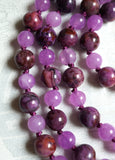 Close up view of 8mm Purple Crazy Lace Agate and 6mm Purple Jade beads. Bright purple knots showcase and protect the beads of this design beautifully.